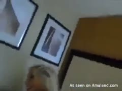 While getting screwed from behind, the golden-haired, tattooed woman nibbles her girlfriend's coochie.